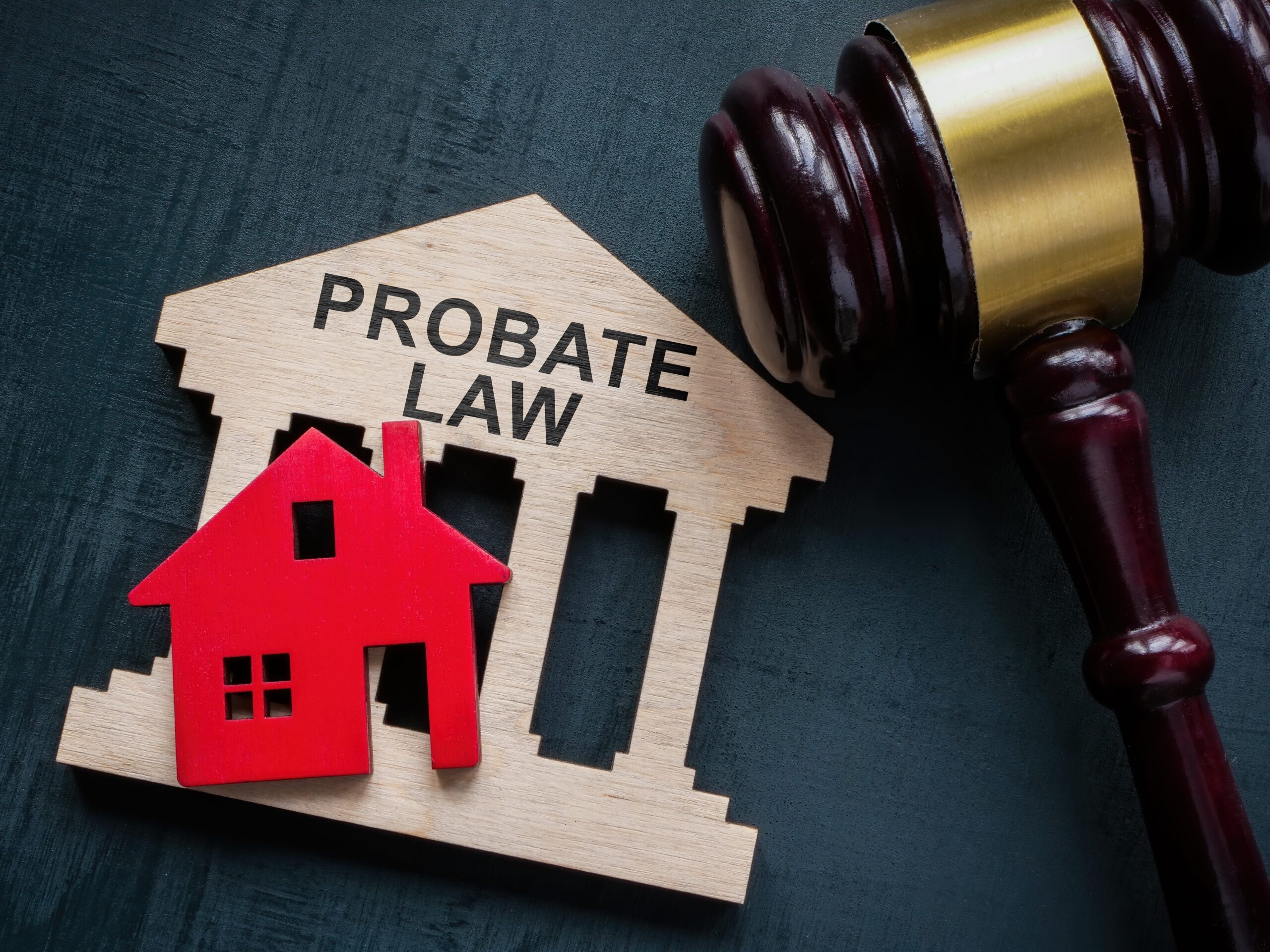 A small house shaped wooden plaque that says probate law on it.