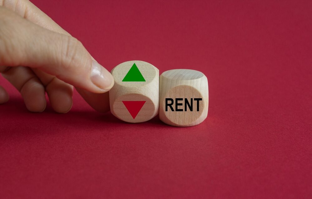 Can My Landlord Increase My Rent two dice, one says rent, the other had a green arrow pointing up on one side and an orange arrow pointing down on the other, signifying rent increase.