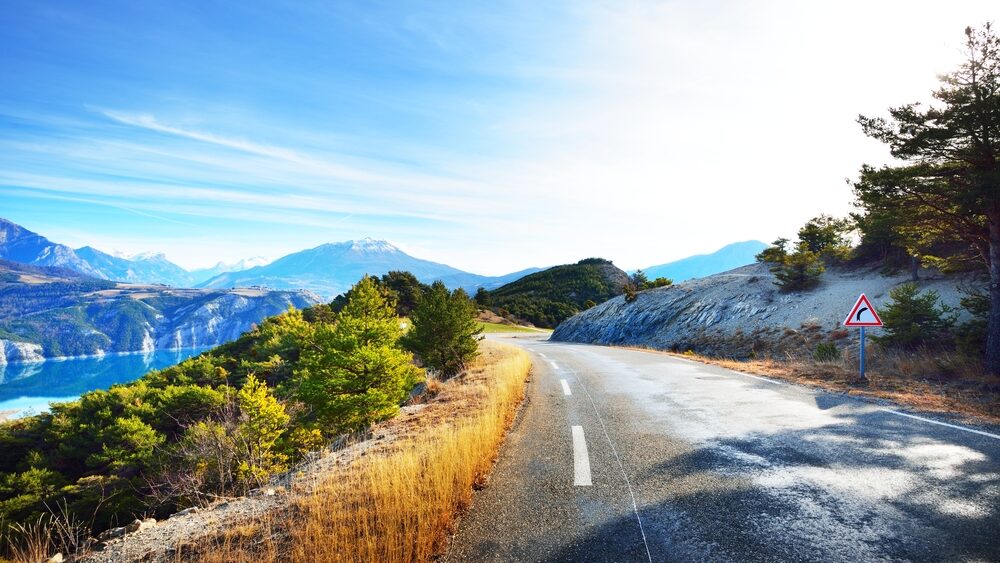 Winding French road through mountains.